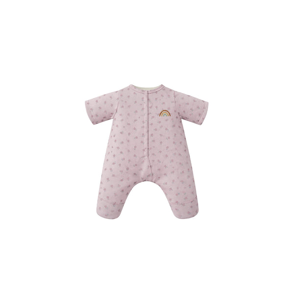 Pink baby onesie with rainbow design on a white background