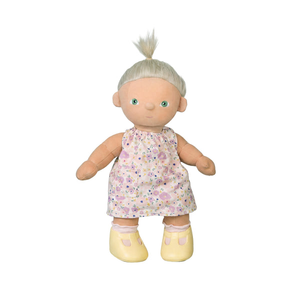 Plush doll with a floral dress on a white background