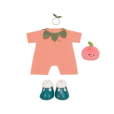 A doll clothing set featuring a peach-colored short-sleeve romper with green leaf details and a small rainbow accent, a pink plush apple toy, and teal booties with white cuffs, all arranged on a white background.