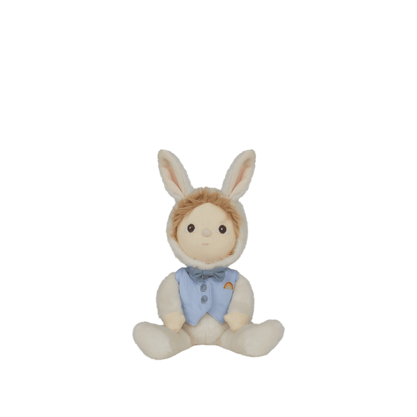 Dinky Dinkums Biffle Bunny doll seated with soft cream fur, long bunny ears, embroidered face, and a blue vest with a colorful rainbow detail
