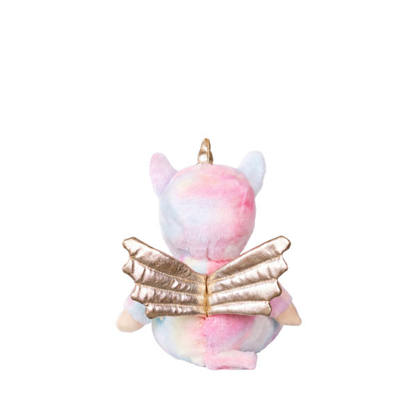 Plush toy with a unicorn design holding a book on a white background