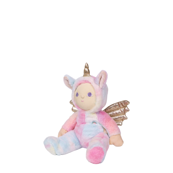 Plush toy in a unicorn costume with pink and gold accents on a white background