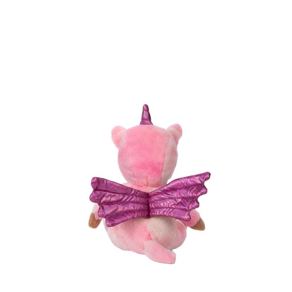 Pink plush toy with purple wings and horn on a white background
