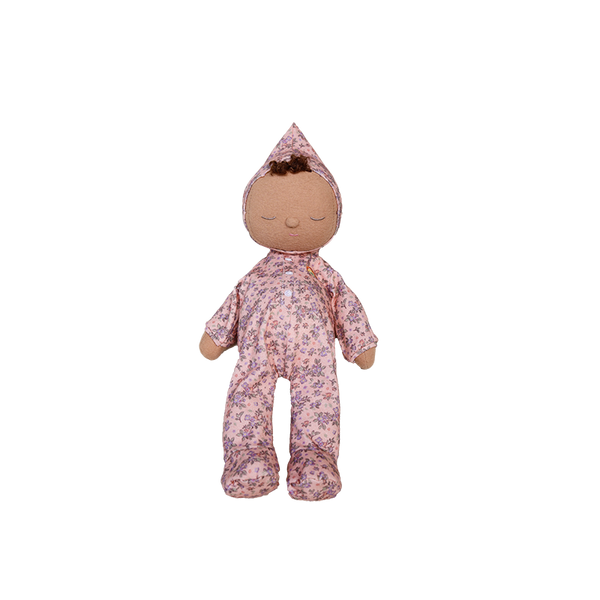 Stuffed doll in a floral outfit on a white background