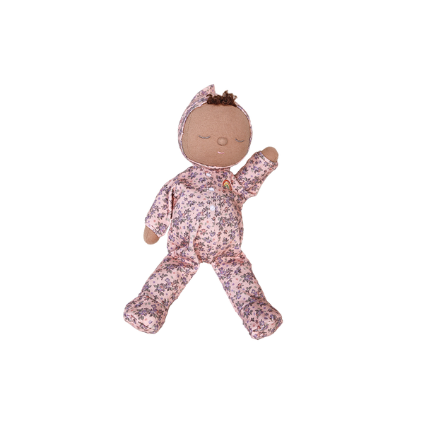 Baby doll in a floral outfit on a white background