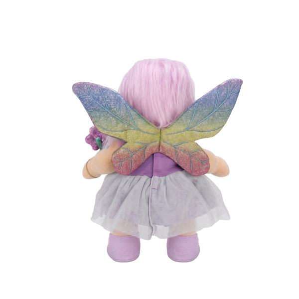 Plush toy fairy with colorful wings on a white background
