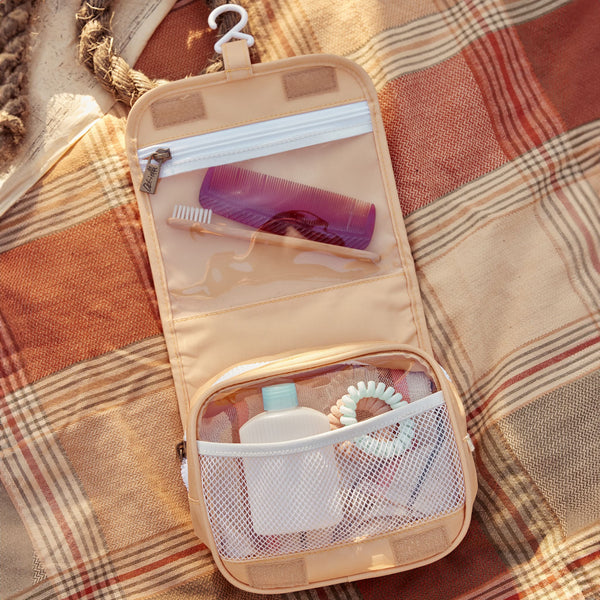 Compact, durable kids yellow toiletry bag by Olli Ella. Perfect for toiletries and travel essentials. Ideal for organized packing, made from eco-friendly materials.