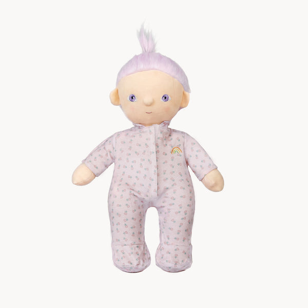 Stuffed toy baby doll with a pink outfit and white hair on a white background