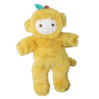 Yellow plush monkey doll with a soft fuzzy body, embroidered face, rounded ears, a small tail, and a green leaf detail on its head.