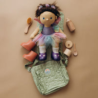 Dinkum Dolls cloth doll in a colorful tutu with a sage green changing bag and wooden grooming accessories for pretend play