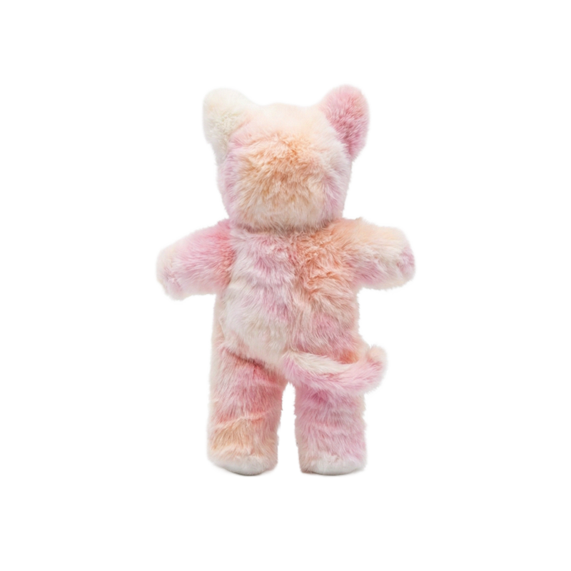 Cozy Day Dinkums Kittycorn Pompom plush toy shown from the back, with soft pink and cream fur, rounded ears, outstretched arms, and a curled tail