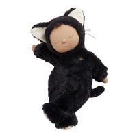 Black plush cat doll with closed eyes, cream inner ears and paws, and a curled tail, Cozy Dinkum Cat Nox by Dinkum Dolls by Olli Ella