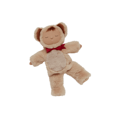 Cozy Dinkums Teddy Crumble plush doll with soft tan fur, closed eyes, rounded ears, outstretched limbs, and a festive red bow around its neck