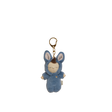 Blue plush bunny bag charm with embroidered features, soft floppy ears, and a gold clip, shown against a black background