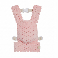 A pink baby carrier seat pad with a polka dot pattern and scalloped edges, shown on a plain white background.