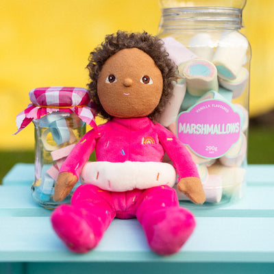 Limited-edition, palm sized, collectable kids plush toy. Sadie Sprinkles is a pink, strawberry  donut weighted plush toy in a velvet onsie, perfect for imaginative kids play.