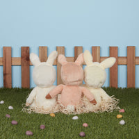 A soft, cuddly plush bunny toy with a apricot-colored coat, perfect for small hands and imaginative play. Perfectly weighted and collectable easter-themed plush toy.