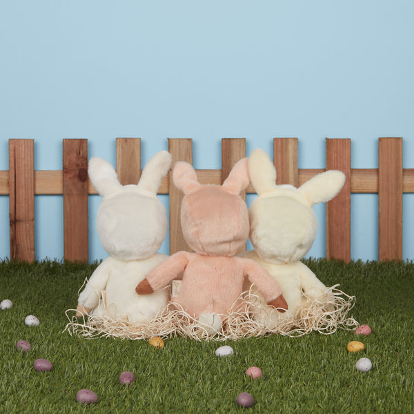 A soft, cuddly plush bunny toy with a apricot-colored coat, perfect for small hands and imaginative play. Perfectly weighted and collectable easter-themed plush toy.