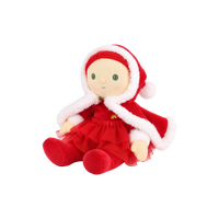 Plush doll with red hair, embroidered green eyes and rosy cheeks, wearing a red velvet hooded cape with white fluffy trim over a red outfit with a tulle skirt, white fluffy cuffs and a small rainbow patch on the chest.