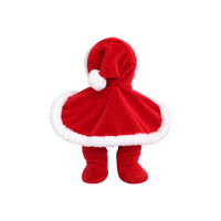 Plush doll with red hair, embroidered green eyes and rosy cheeks, wearing a red velvet hooded cape with white fluffy trim over a red outfit with a tulle skirt, white fluffy cuffs and a small rainbow patch on the chest.