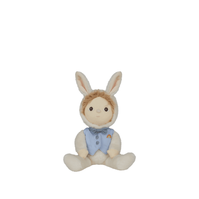 Dinky Dinkums Biffle Bunny doll seated with soft cream fur, long bunny ears, embroidered face, and a blue vest with a colorful rainbow detail