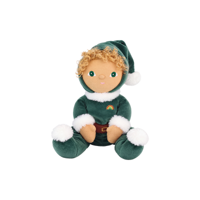 Plush doll with curly golden hair and embroidered green eyes, dressed as a Christmas elf in a dark green velvet suit and pointed hat with white fluffy trim, a brown belt, and a small rainbow patch on the chest.