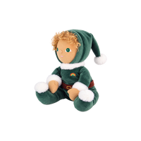 Plush doll with curly golden hair and embroidered green eyes, dressed as a Christmas elf in a dark green velvet suit and pointed hat with white fluffy trim, a brown belt, and a small rainbow patch on the chest.