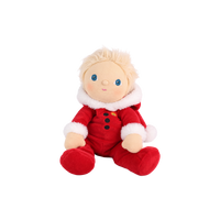 A plush doll with blond hair, blue eyes, and a red outfit with white faux-fur trim, seated against a plain white background.
