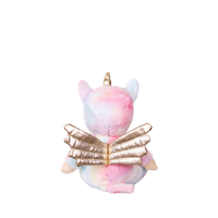 Plush toy with a unicorn design holding a book on a white background