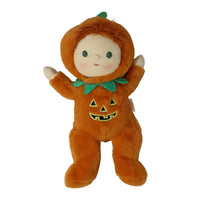 Plush Jules Jack-o-Lantern doll in a soft orange pumpkin costume with leafy collar, green stem, rosy cheeks and raised arms by Dinkum Dolls by Olli Ella