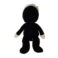 Back view of Dinky Dinkum Scully Skeleton doll in a black plush outfit with cream hands and a tuft of white hair, by Dinkum Dolls by Olli Ella