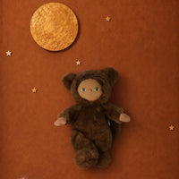 Brown werewolf plush doll with a friendly face lying beneath a golden full moon and stars on a warm rust colored background by Dinkum Dolls by Olli Ella