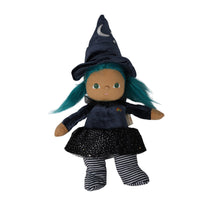 Dinkum Dolls by Olli Ella Winnie Witch doll with teal hair, crescent moon hat, black starry skirt, and striped legs on a white background