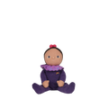 Dinky Dinkums Freya Fondant doll seated in a purple knitted outfit with a rainbow detail, brown face, and two red hair bows on a black background