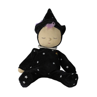 Sleeping black witch doll in a starry outfit and pointed hat, with closed eyes and soft purple hair, from Dinkum Dolls by Olli Ella