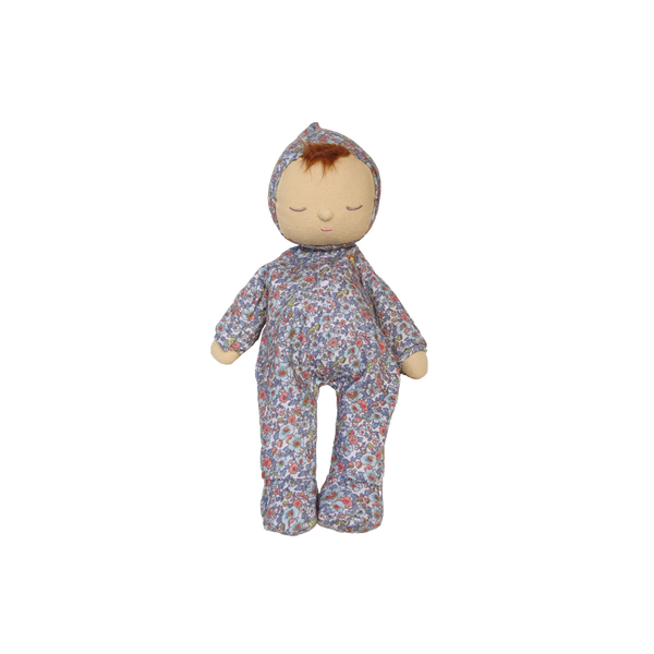 Stuffed doll with floral patterned outfit on a white background