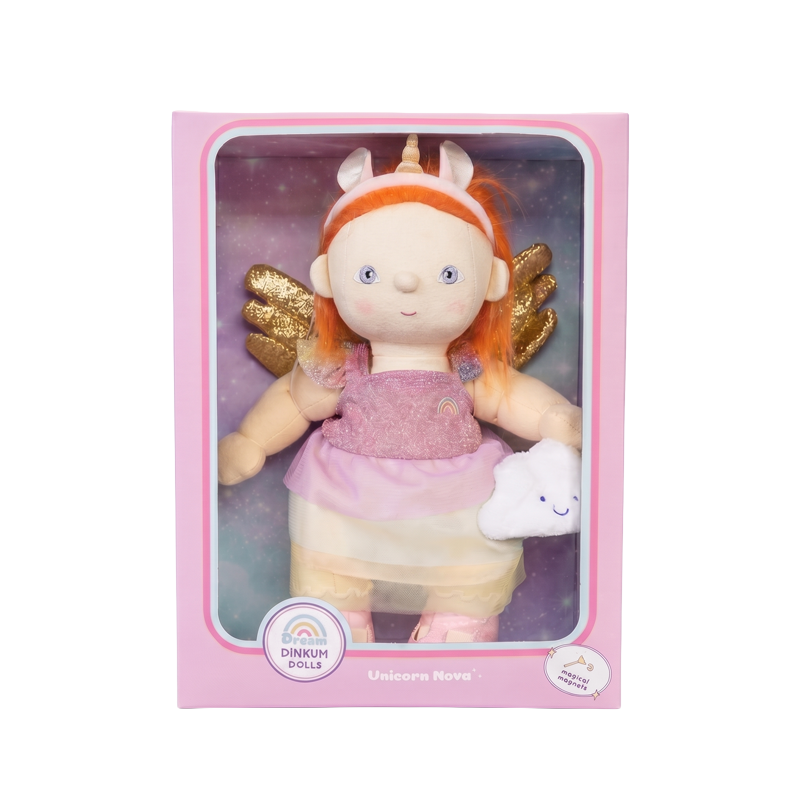 Dinkum Dolls Unicorn Nova doll in a pink box, with bright ginger hair, unicorn headband, glittery wings, pink dress, and a small white cloud accessory.