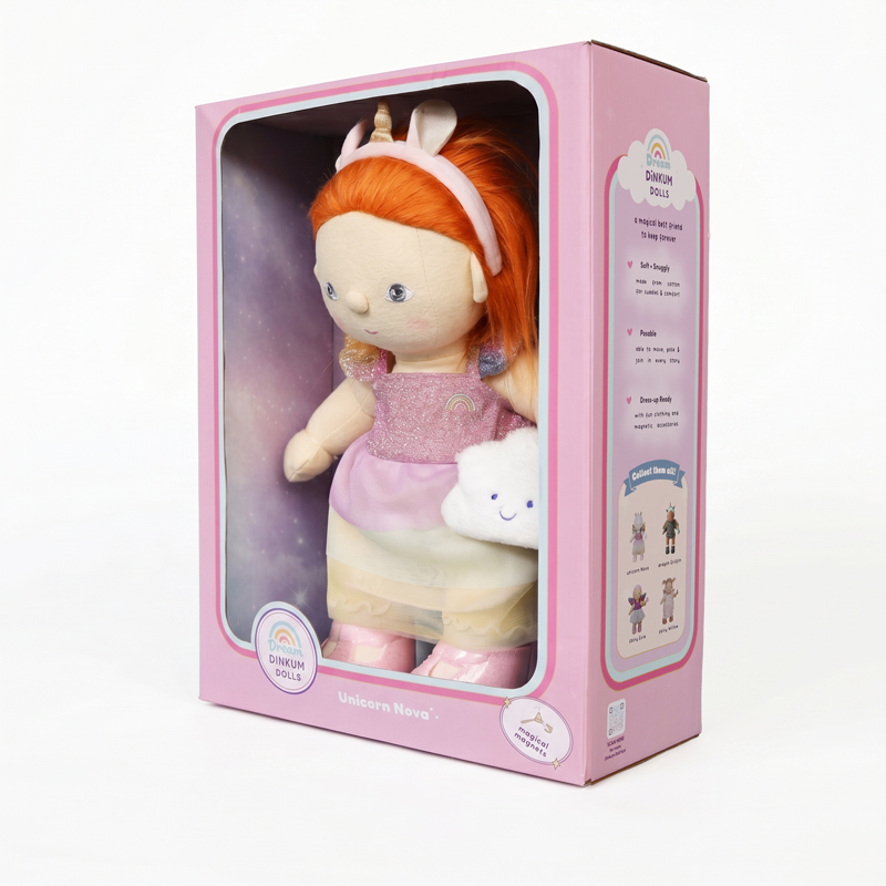 Boxed Dinkum Dolls Unicorn Nova doll with bright ginger hair, unicorn headband, pink outfit, and a small white cloud companion in colorful packaging.