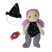 Willa Witch doll with pink hair wearing a starry black outfit and striped leggings beside a matching witch hat and wrapped candy by Dinkum Dolls by Olli Ella