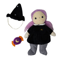 Willa Witch doll with purple hair, black dress, striped leggings, starry witch hat, and wrapped purple candy accessory from Dinkum Dolls by Olli Ella