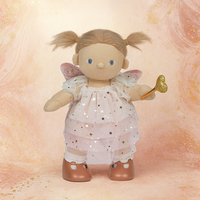 Dinkum Dolls fairy doll wearing a pearl tulle dress with star details, blush velvet wings, and brown shoes while holding a golden wand against a peach backdrop