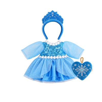 Blue doll dress-up set: a sequinned blue dress with sheer sparkly sleeves, white daisy trim and a layered tulle and satin skirt, a blue velvet tiara headband with embroidered snowflake detail, and a heart-shaped velvet bag embroidered with a silver snowflake on a gold chain.