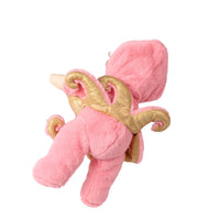 A pink plush toy shaped like a stylized character with gold wing-like accents, shown against a plain white background.