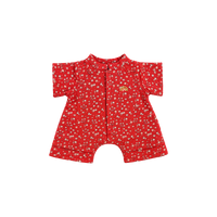 Red short-sleeved doll romper with a ditsy pink and white floral print, a front placket, short legs, and a small yellow embroidered rainbow on the chest.