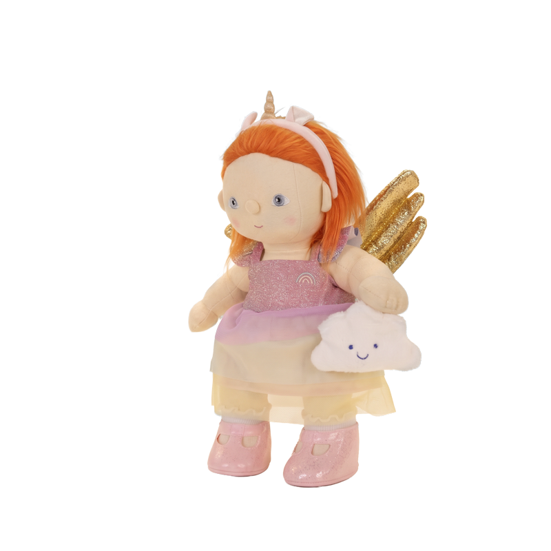 Doll wearing a pink glitter dress with a layered tulle skirt, cloud detail, pink boots, unicorn headband, and shimmering gold wings