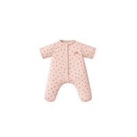 Pink baby snowsuit with rainbow design on a white background