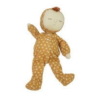 Dozy Dinkum doll with tan velvety onsie outfit. Perfectly weighted doll for calm. Plush doll with red hair, perfect for cuddling and interactive doll play.