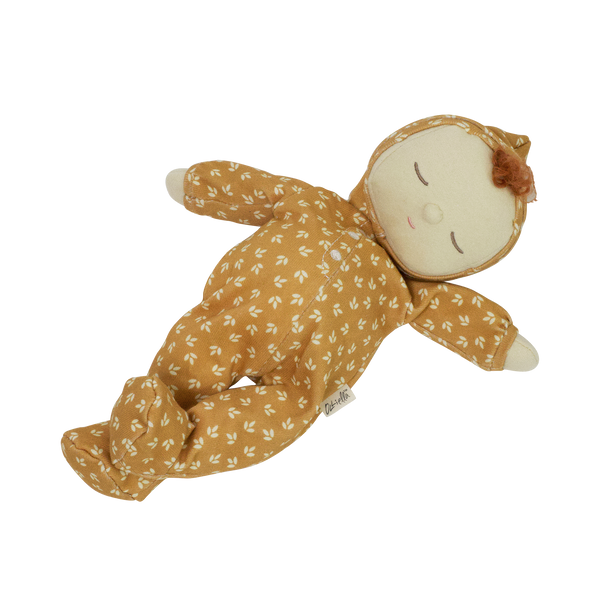 Dozy Dinkum doll with tan velvety onsie outfit. Perfectly weighted doll for calm. Plush doll with red hair, perfect for cuddling and interactive doll play.