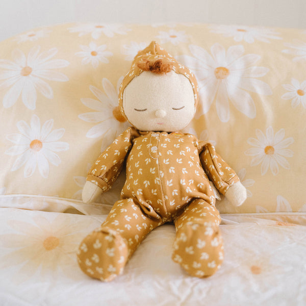 Gender-neutral posable plush doll with tan coloured velvety onsie outfit. Perfectly weighted for cuddles and bedtime. Suitable toy from birth.