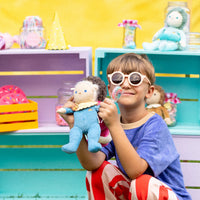 Limited-edition, palm sized, collectable corduroy kids plush toy. Bonnie Buttercream is a blue weighted plush toy in a velvet onsie, perfect for imaginative kids play.